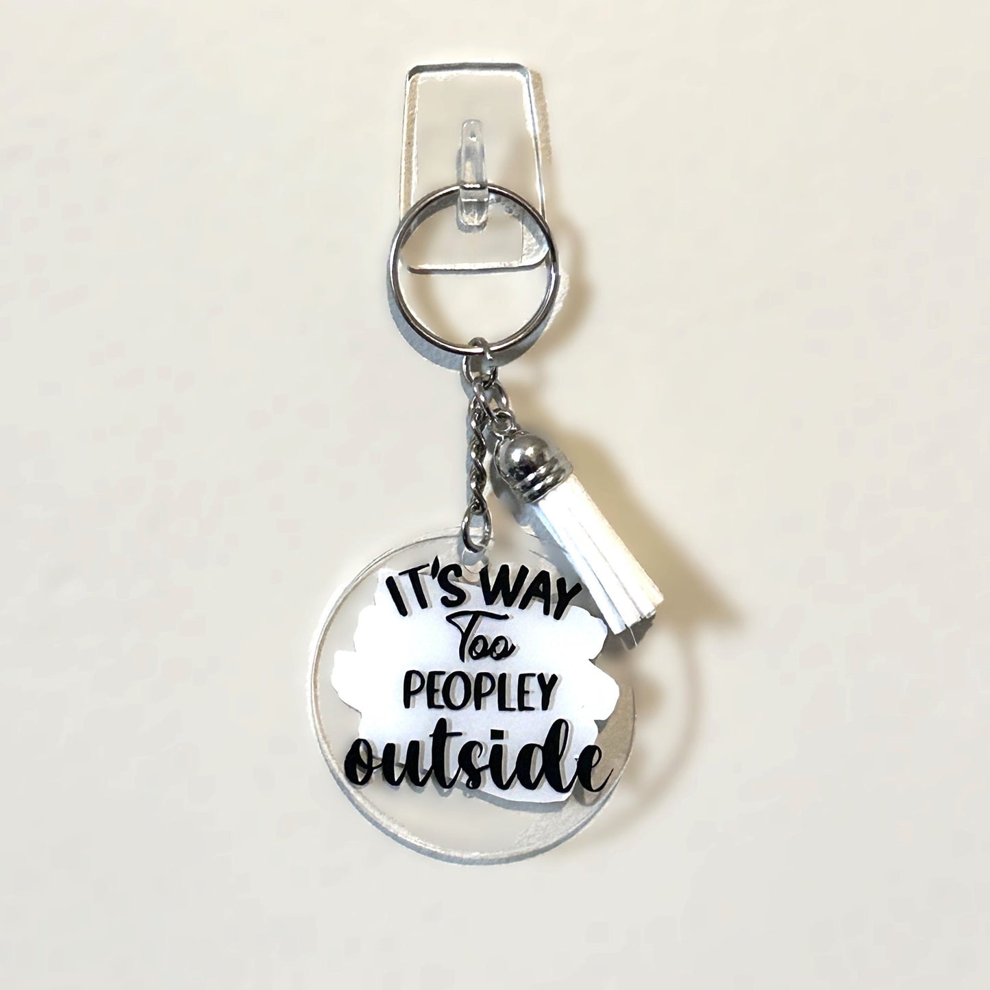 2" acrylic keychain with tassel, its too peopley outside