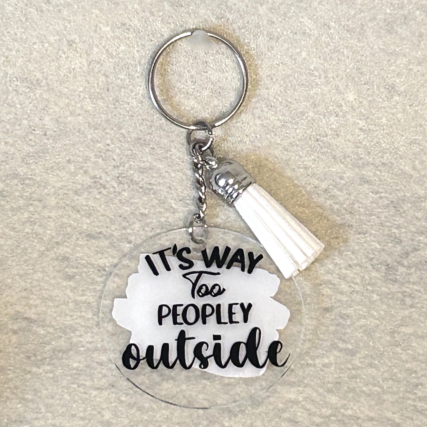 2" acrylic keychain with tassel, its too peopley outside